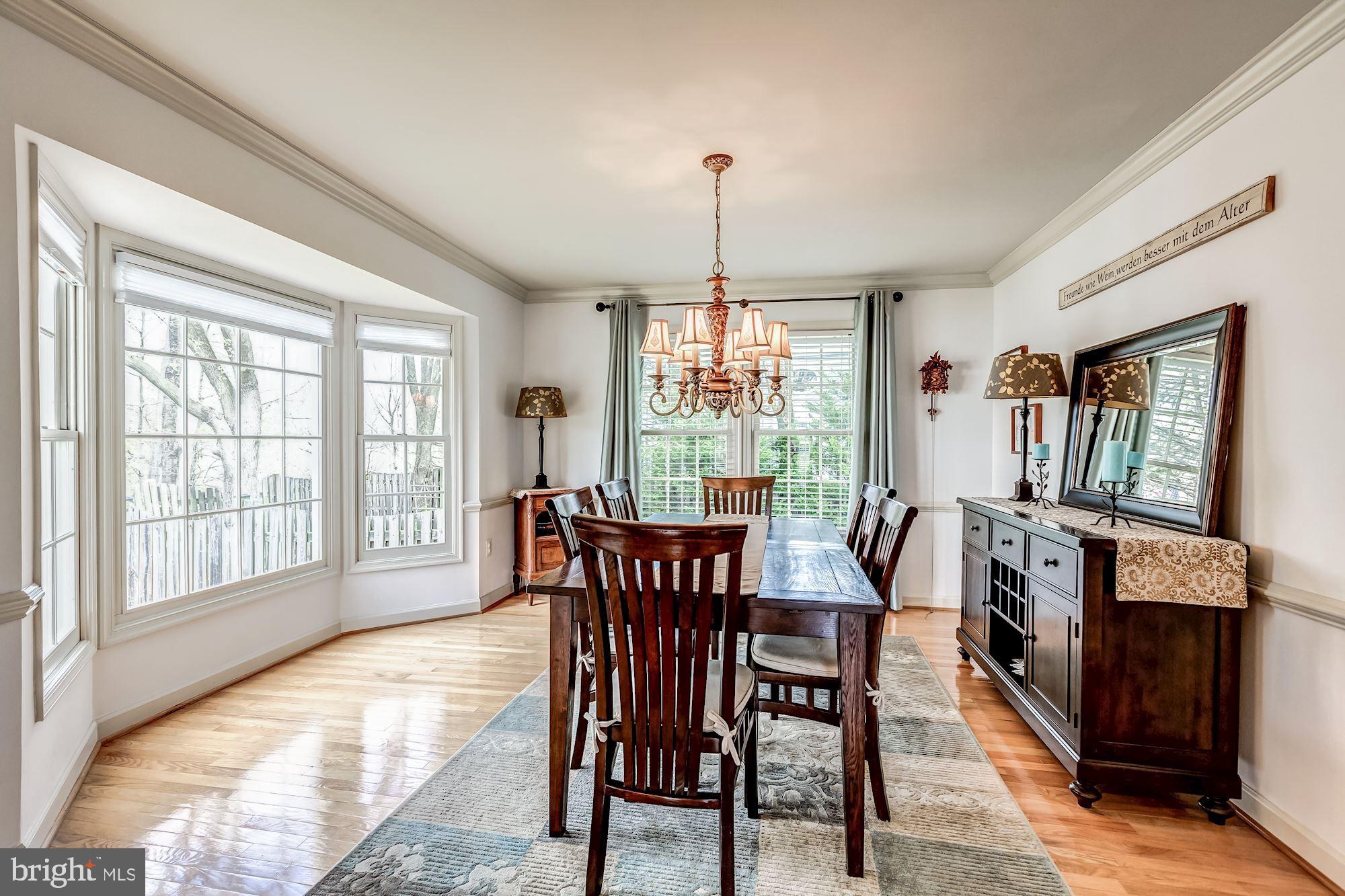 6402 Springhouse Circle Clifton, VA 20124 - Photo 11 of 43 a view of a dining room with furniture window and outside view