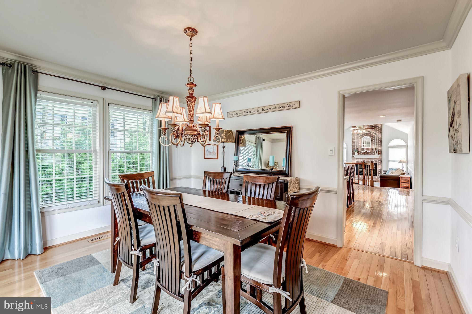 6402 Springhouse Circle Clifton, VA 20124 - Photo 12 of 43 a dining room with furniture window wooden floor