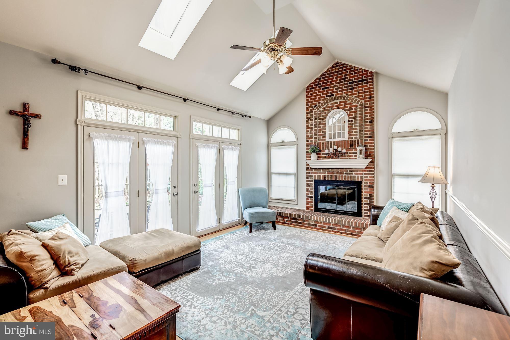 6402 Springhouse Circle Clifton, VA 20124 - Photo 14 of 43 a living room with furniture and a fireplace