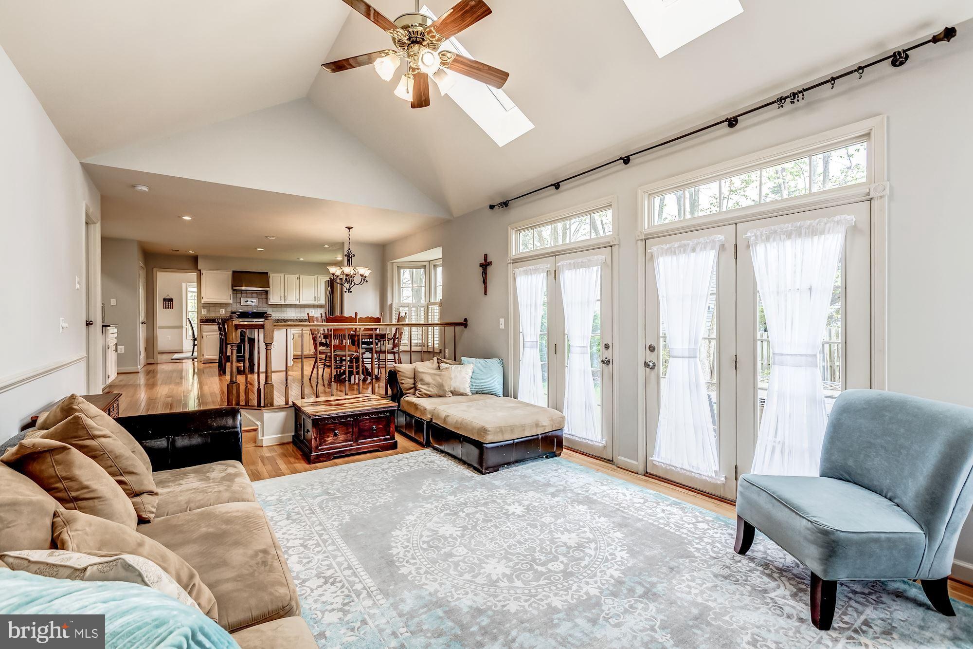 6402 Springhouse Circle Clifton, VA 20124 - Photo 15 of 43 a living room with furniture and a large window