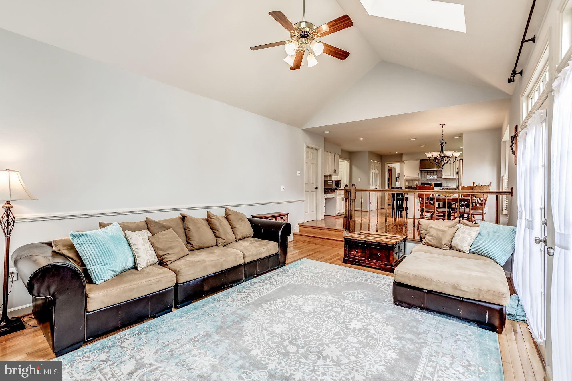 6402 Springhouse Circle Clifton, VA 20124 - Photo 16 of 43 a living room with furniture and a couch