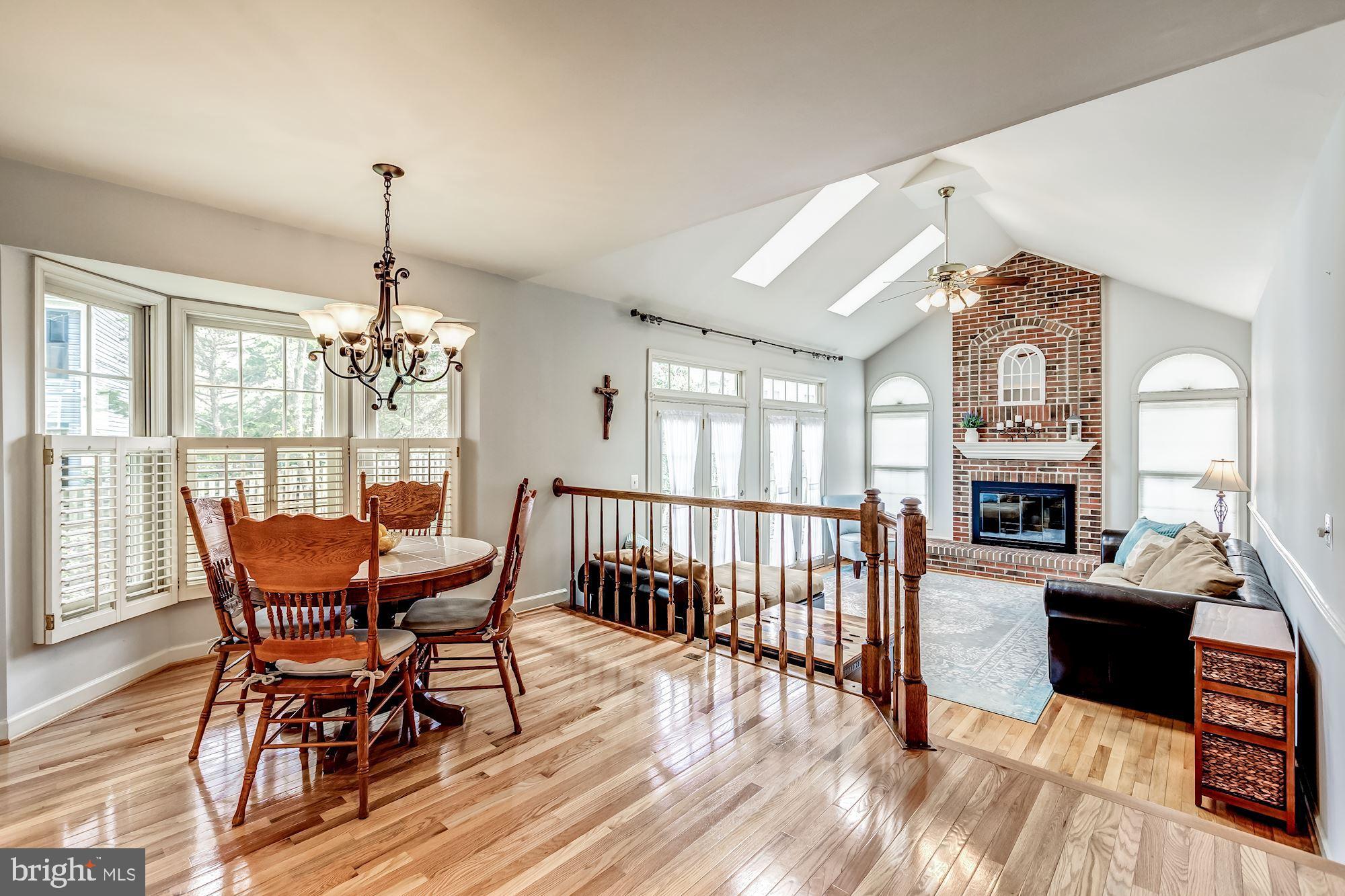 6402 Springhouse Circle Clifton, VA 20124 - Photo 17 of 43 a view of a dining room with furniture window and wooden floor