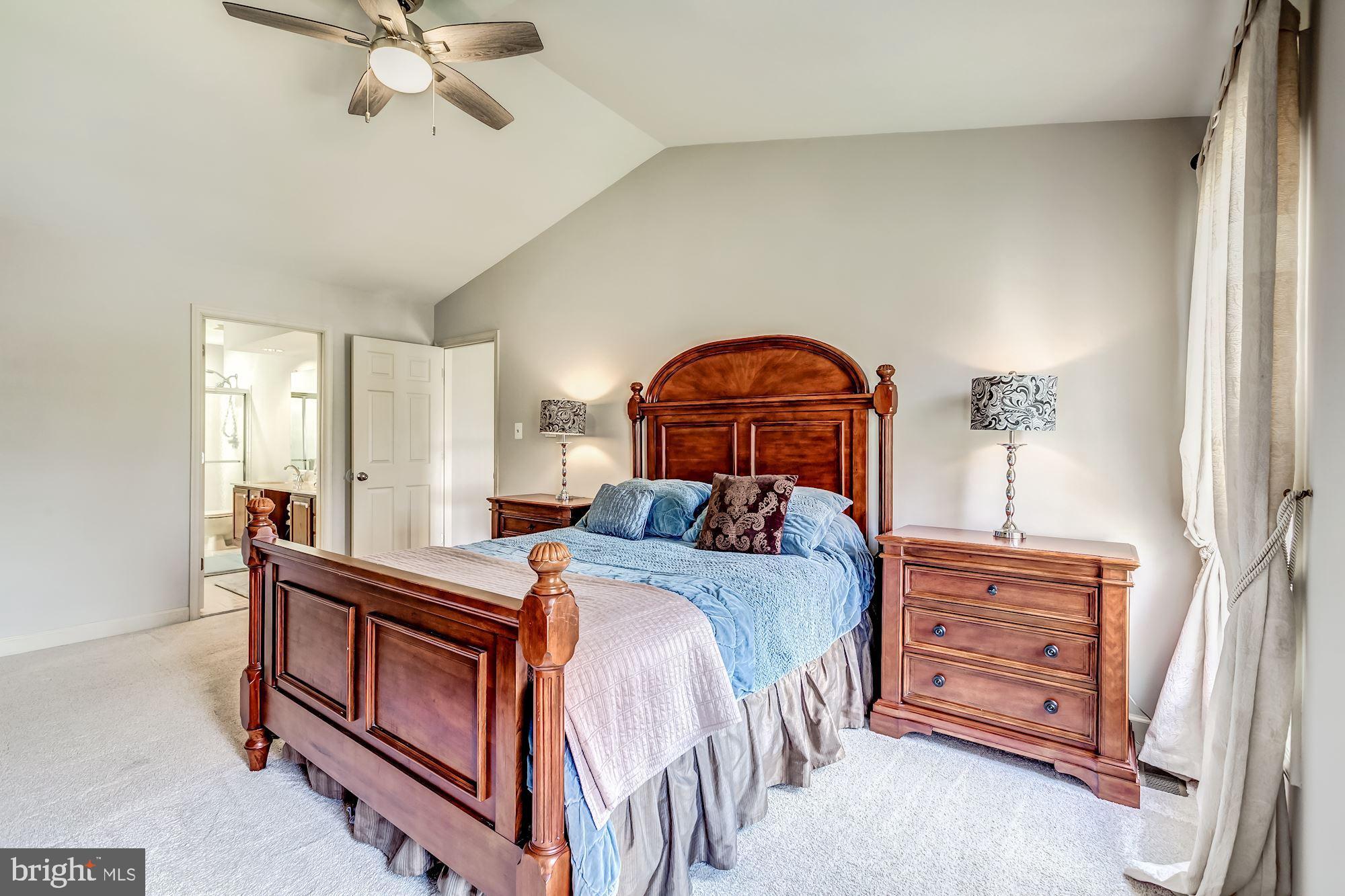 6402 Springhouse Circle Clifton, VA 20124 - Photo 30 of 43 a bedroom with a bed and a dresser