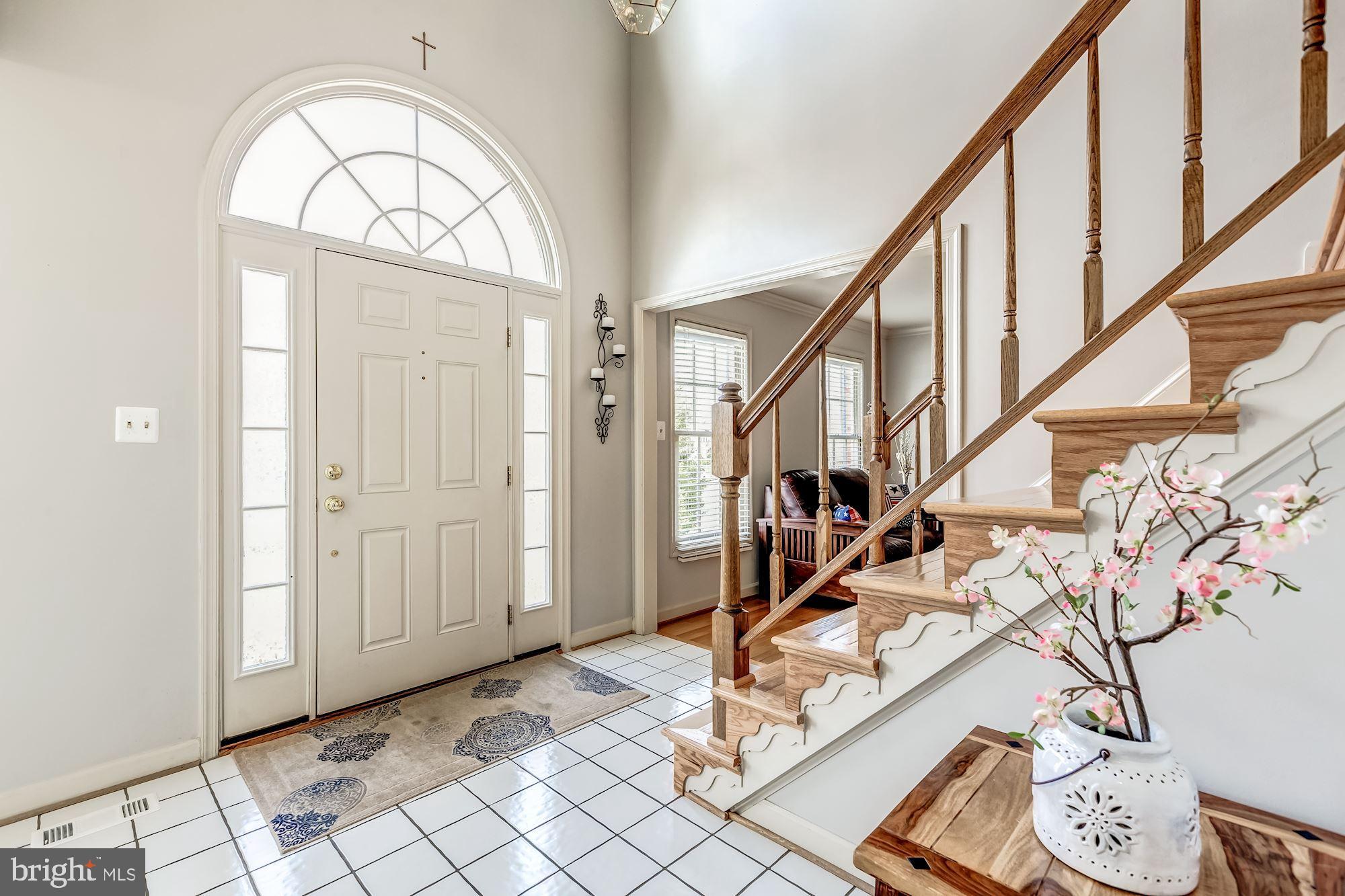 6402 Springhouse Circle Clifton, VA 20124 - Photo 4 of 43 a view of an entryway with wooden floor