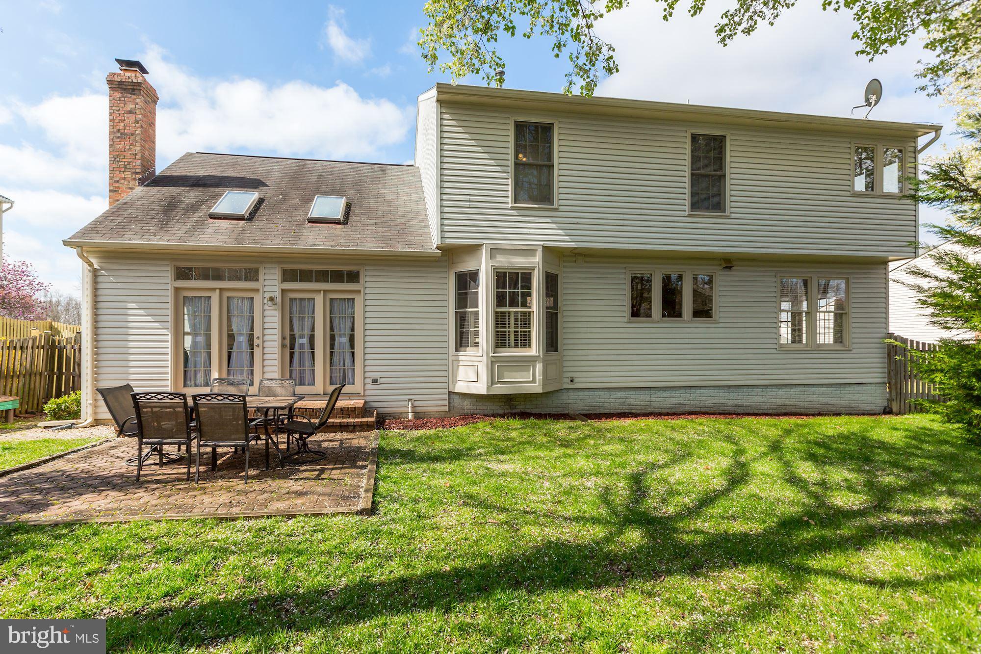 6402 Springhouse Circle Clifton, VA 20124 - Photo 40 of 43 a front view of a house with garden