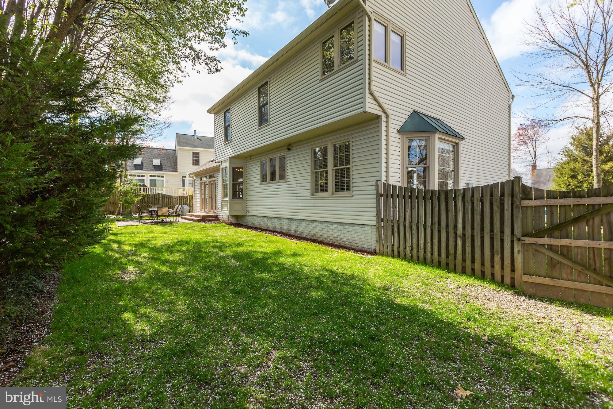 6402 Springhouse Circle Clifton, VA 20124 - Photo 42 of 43 a front view of a house with a garden