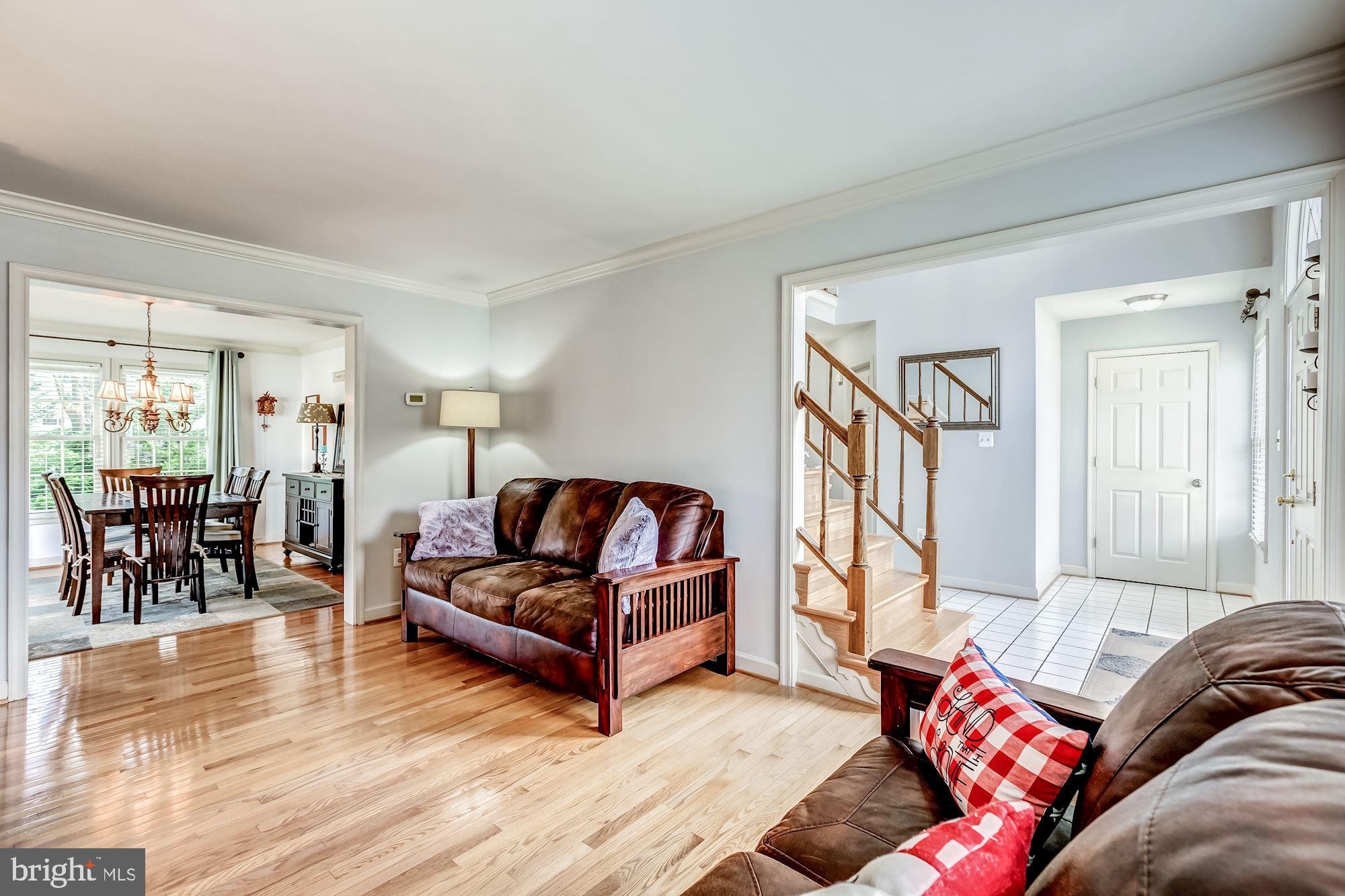 6402 Springhouse Circle Clifton, VA 20124 - Photo 7 of 43 a living room with furniture and a large window