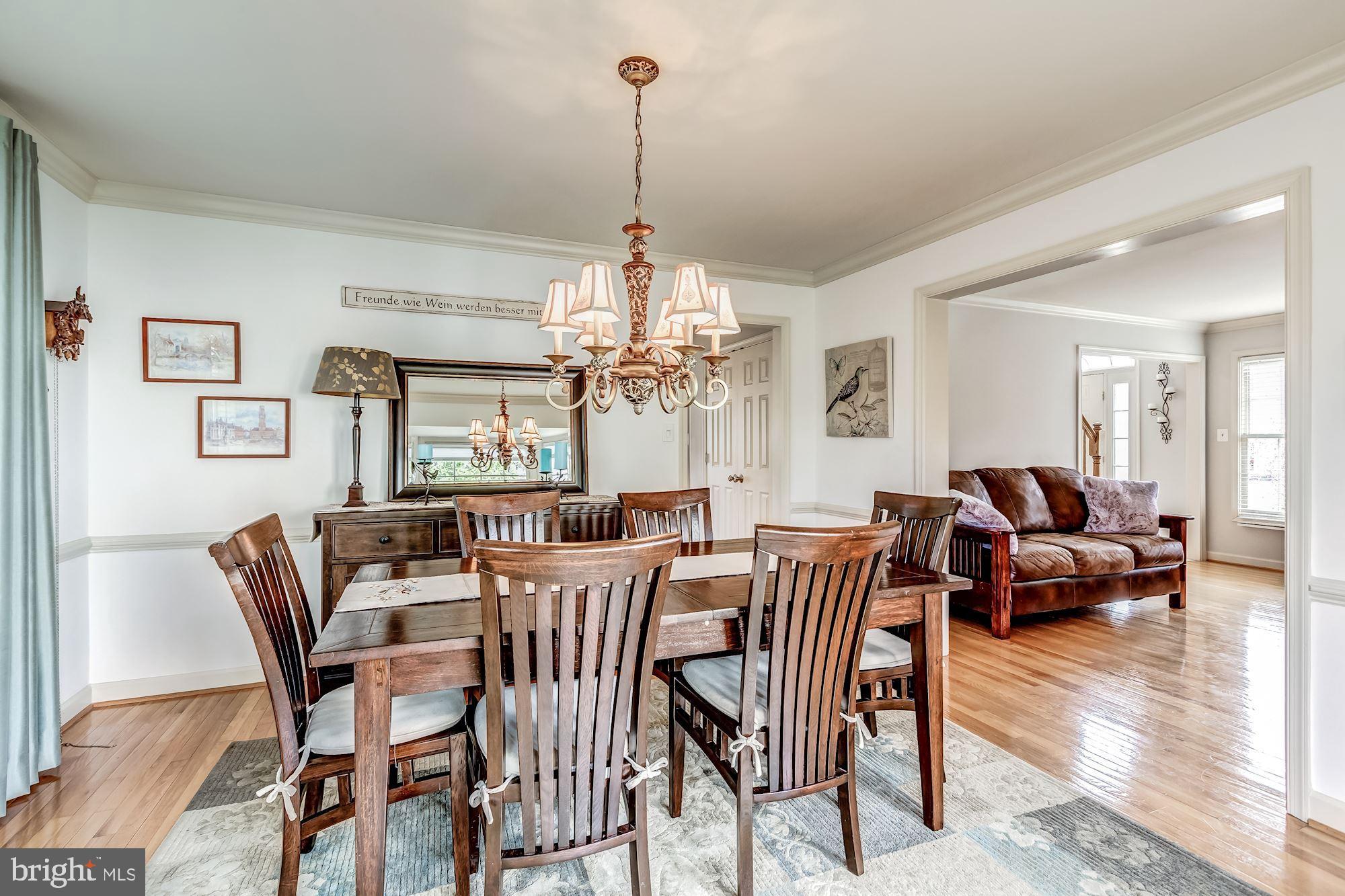 6402 Springhouse Circle Clifton, VA 20124 - Photo 10 of 43 a view of a dining room with furniture window and wooden floor