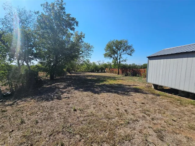 a view of backyard with green space