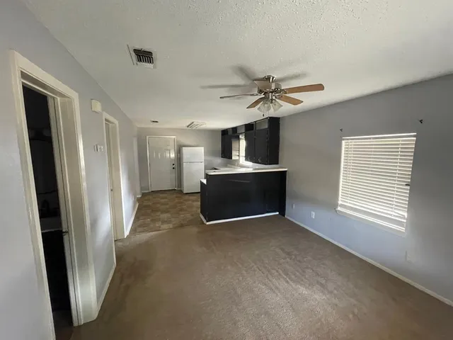 a view of kitchen and windows