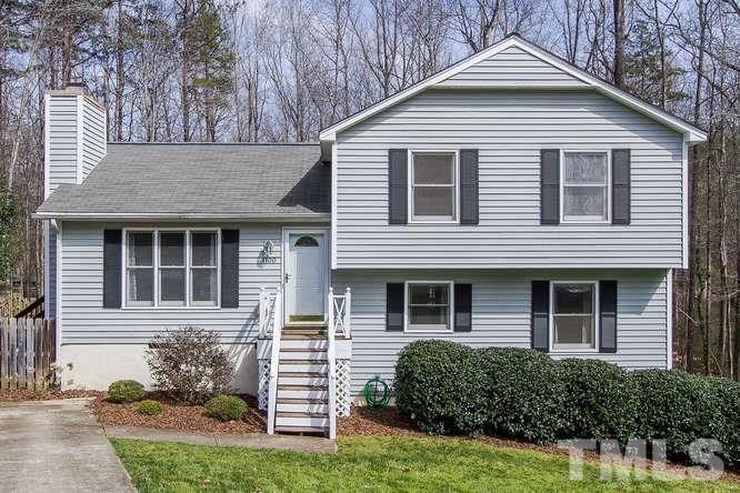 1100 Toppe Ridge Court Raleigh, NC 27615 - Photo 1 of 22 a front view of a house with a yard