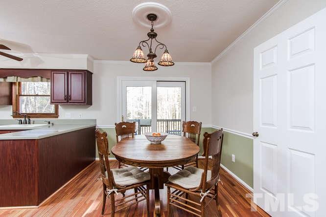 1100 Toppe Ridge Court Raleigh, NC 27615 - Photo 5 of 22 a view of a dining room with furniture window and wooden floor