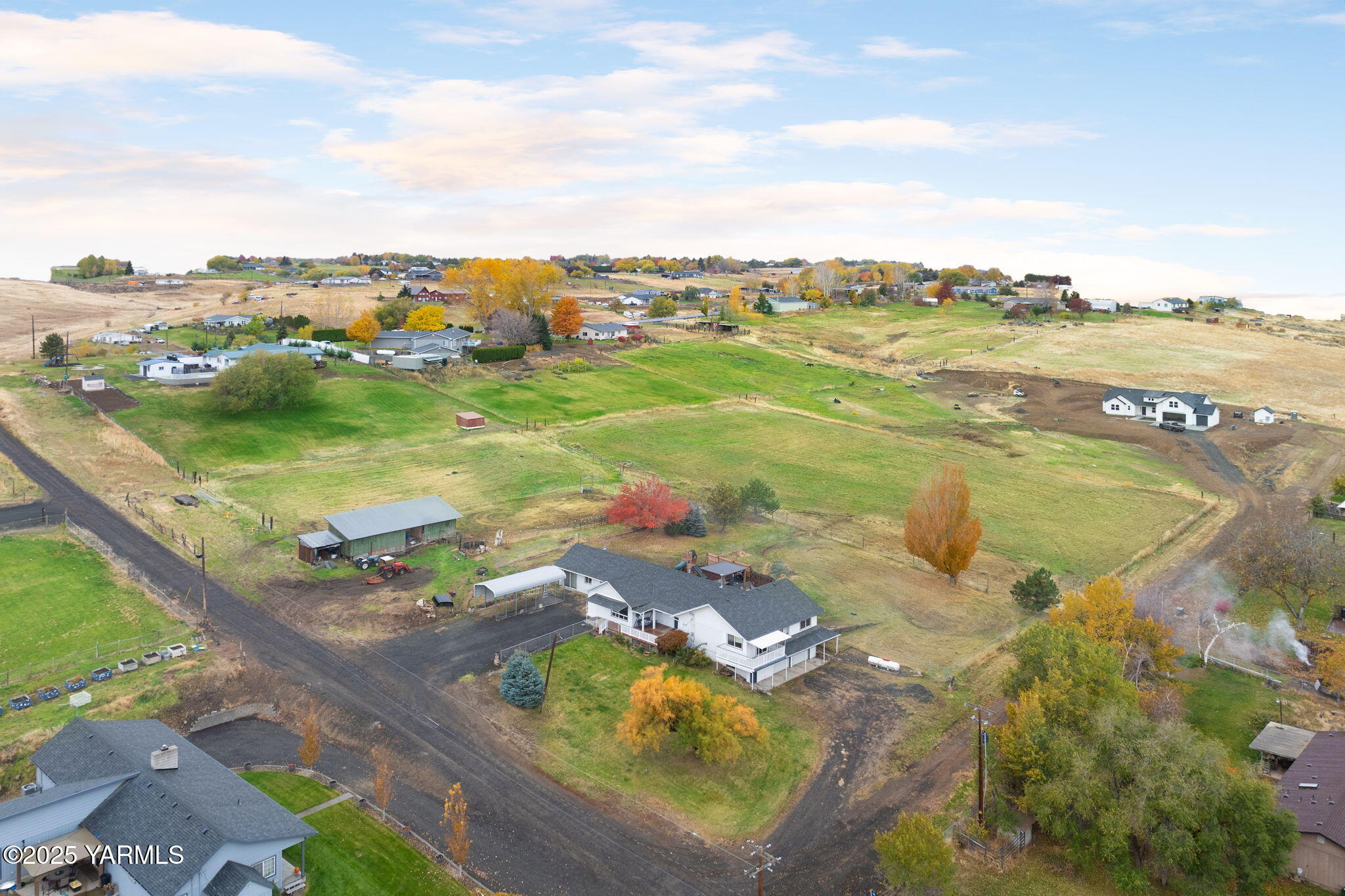 an aerial view of residential houses with outdoor space