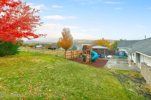 a view of a chairs and table in the patio