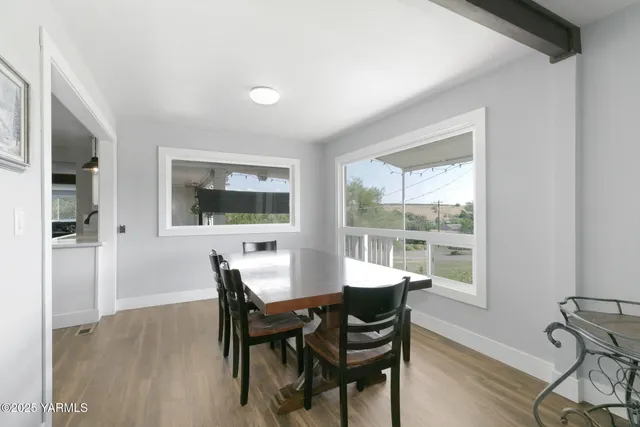 a dining room with furniture and window