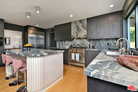 a view of balcony with furniture