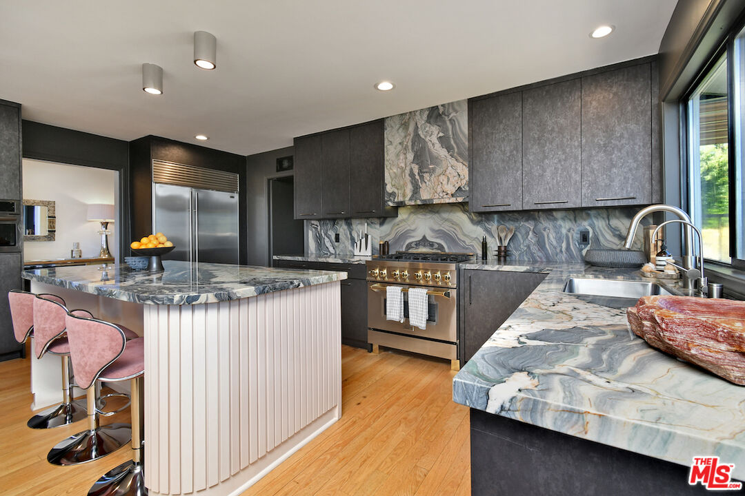 130 Dapplegray Road Bell Canyon, CA 91307 - Photo 13 of 48 a kitchen with stainless steel appliances granite countertop a stove and a sink