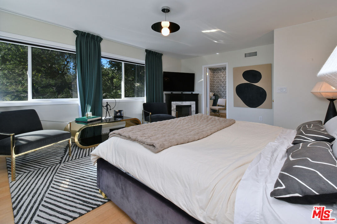 130 Dapplegray Road Bell Canyon, CA 91307 - Photo 18 of 48 a bedroom with a large bed and a flat tv screen on dresser