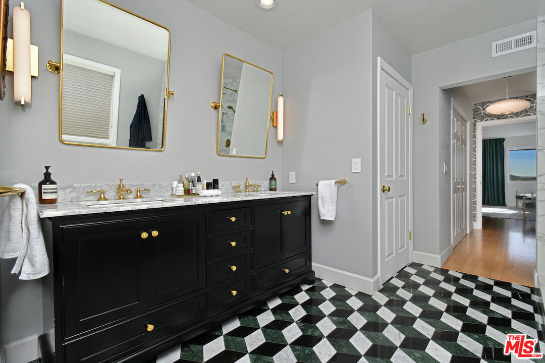 130 Dapplegray Road Bell Canyon, CA 91307 - Photo 20 of 48 a bathroom with a double vanity sink and mirror