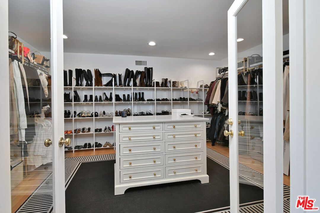 130 Dapplegray Road Bell Canyon, CA 91307 - Photo 21 of 48 a view of walk in closet with clothes