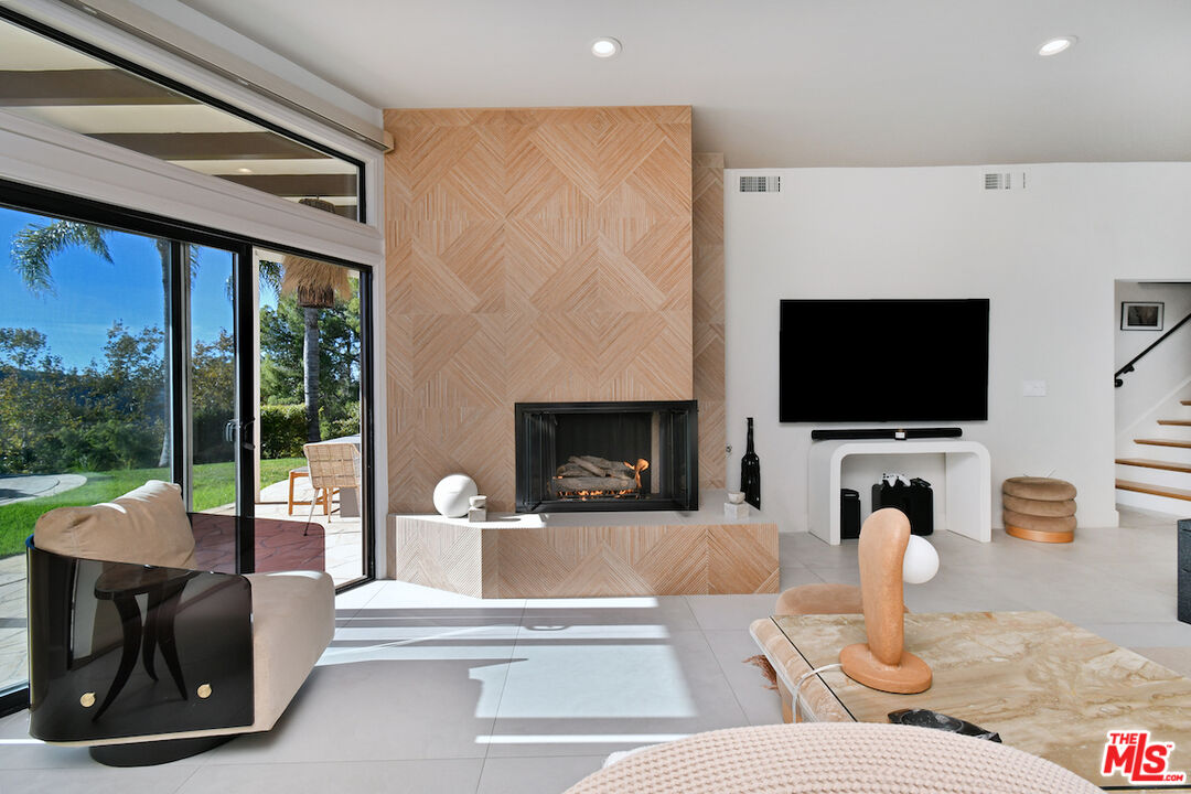 130 Dapplegray Road Bell Canyon, CA 91307 - Photo 30 of 48 a living room with fireplace furniture and a flat screen tv