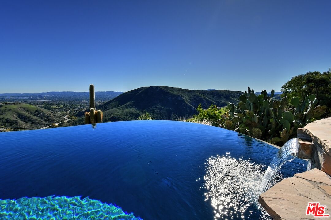 130 Dapplegray Road Bell Canyon, CA 91307 - Photo 34 of 48 a view of a small yard and mountain view in back