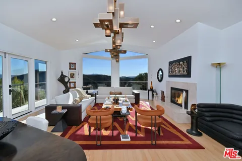 a bedroom with bed and a couch