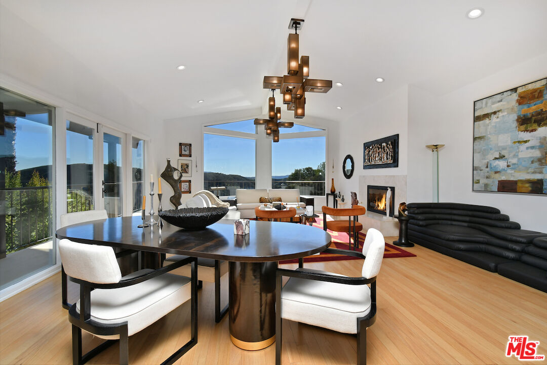 130 Dapplegray Road Bell Canyon, CA 91307 - Photo 8 of 48 a living room with fireplace furniture and a large window
