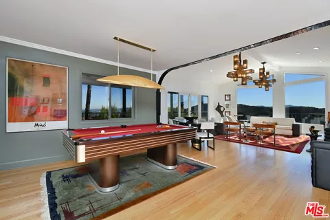 a living room with furniture and a rug