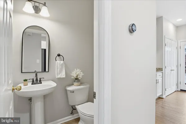 a view of staircase with white walls and windows