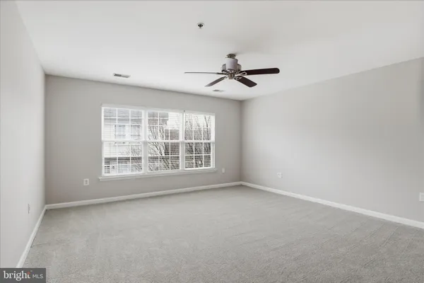 a bathroom with a double vanity sink toilet and shower