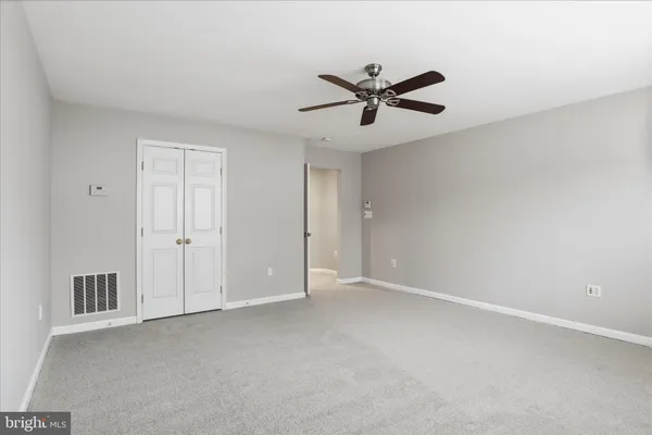 a spacious bathroom with a tub shower and sink
