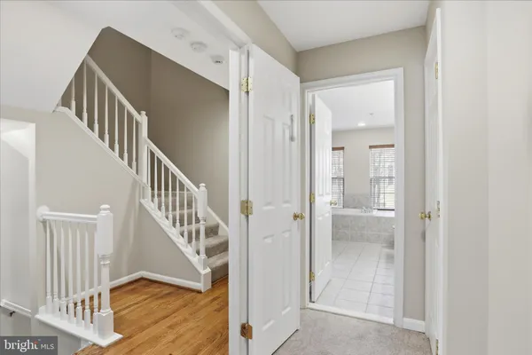 a view of an empty room with a ceiling fan