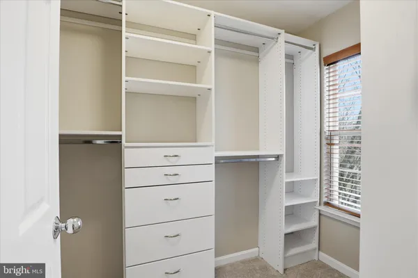 a bathroom with a sink toilet and a mirror
