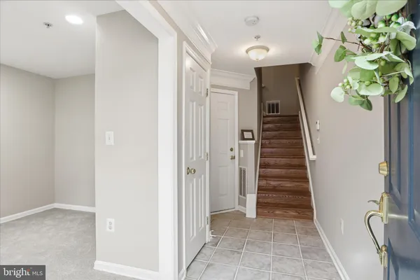 a view of an entryway with wooden floor