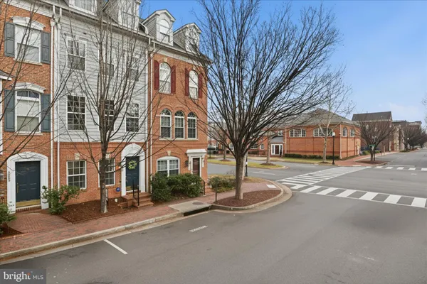 a view of a park with bench and trees