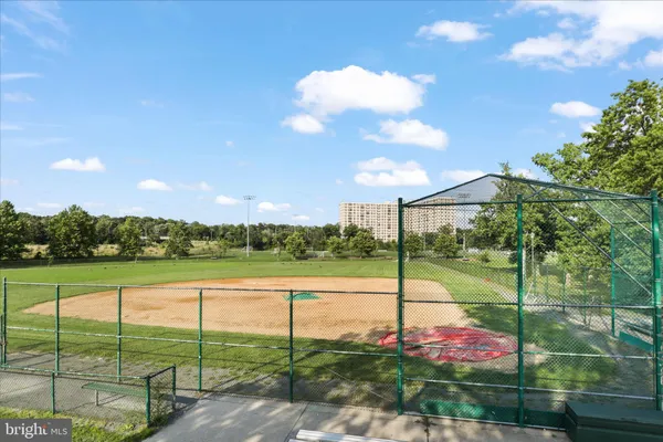 a view of a brick house with large windows