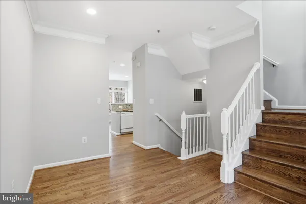 a kitchen with granite countertop a sink stove and refrigerator
