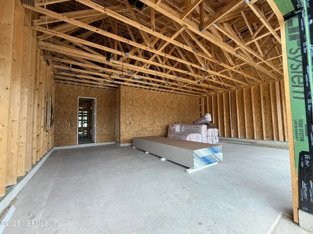 a view of a hall with wooden floor