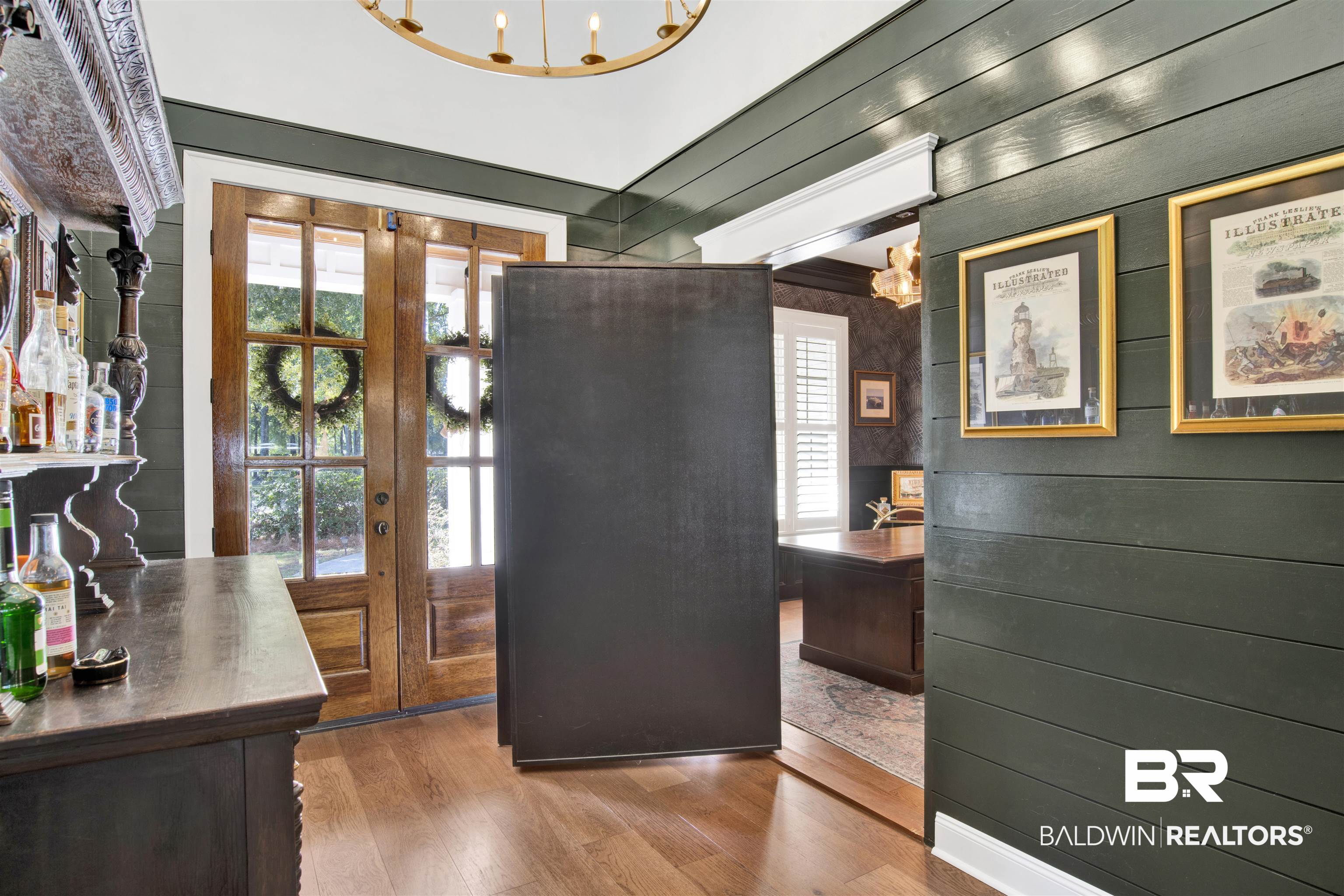11116 Redfern Road Daphne, AL 36526 - Photo 23 of 46 Entryway featuring plenty of natural light, wood finished floors, wood walls, and a chandelier