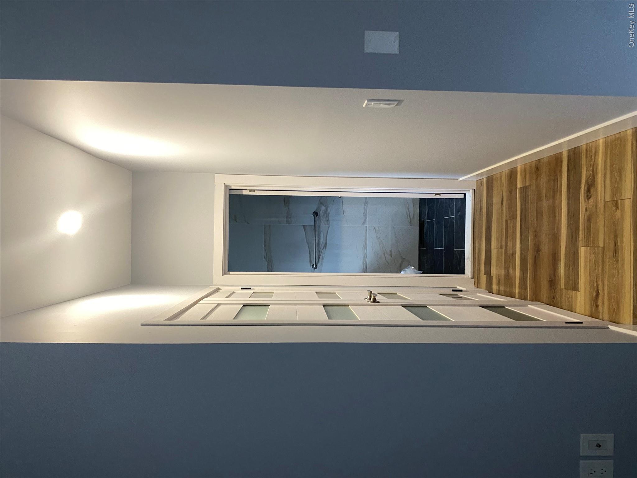 44 Roslyn Ridge Road Mongaup Valley, NY 12762 - Photo 14 of 24 Corridor featuring dark wood-style flooring and baseboards