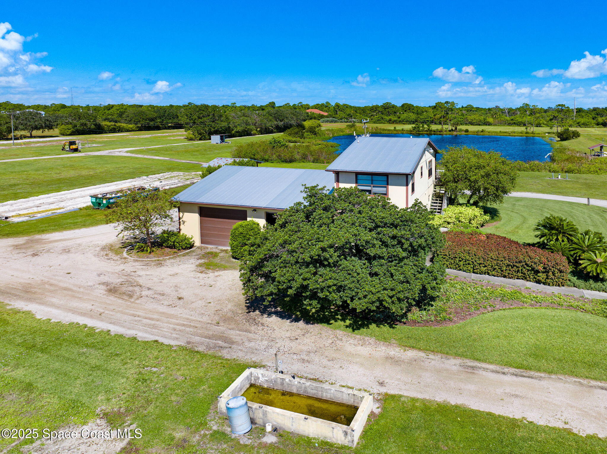 C Berry Road Grant Valkaria, FL 32949 - Photo 44 of 46 an aerial view of a house with garden space and street view