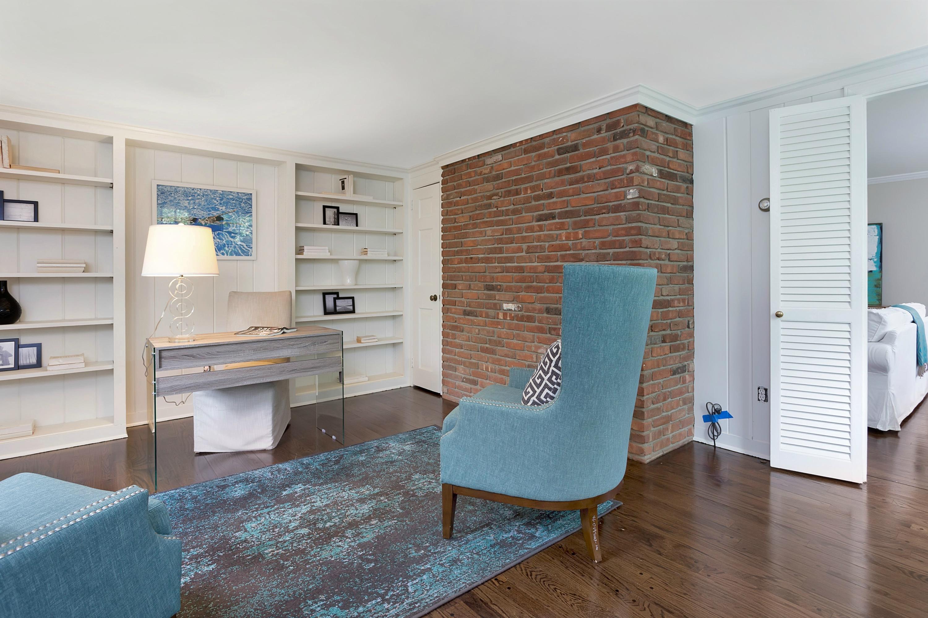 276 Smith Ridge Road New Canaan, CT 06840 - Photo 11 of 23 a living room with stainless steel appliances furniture a rug and a window