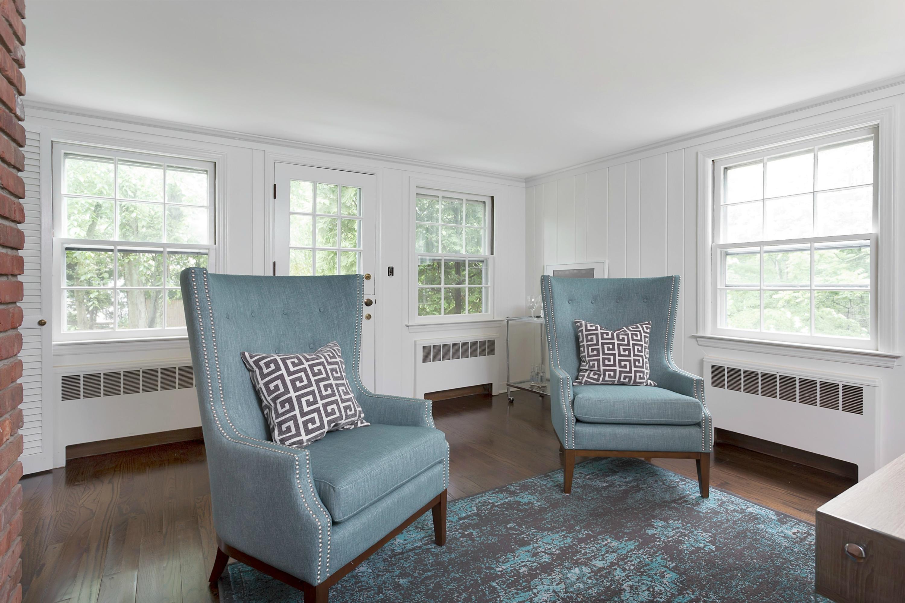 276 Smith Ridge Road New Canaan, CT 06840 - Photo 12 of 23 a living room with furniture and a window