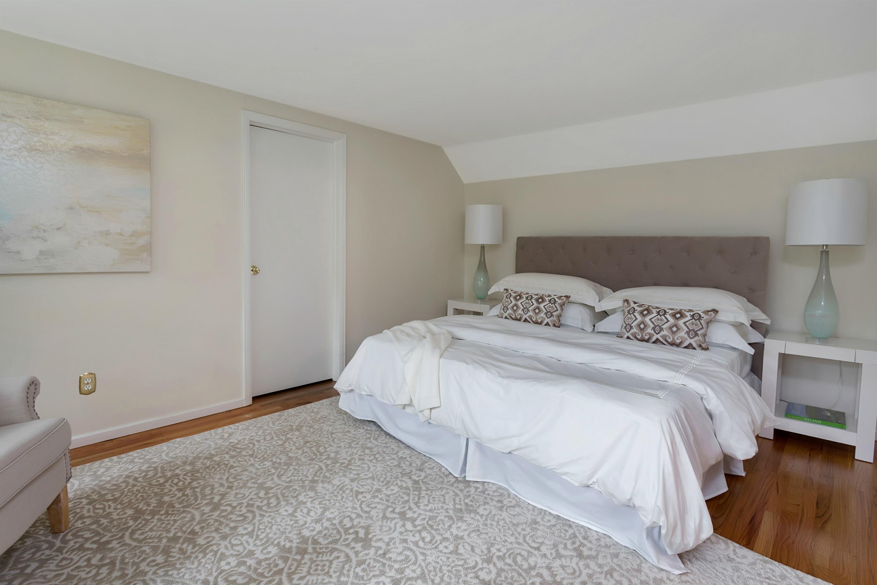 276 Smith Ridge Road New Canaan, CT 06840 - Photo 13 of 23 a bedroom with a bed and wooden floor