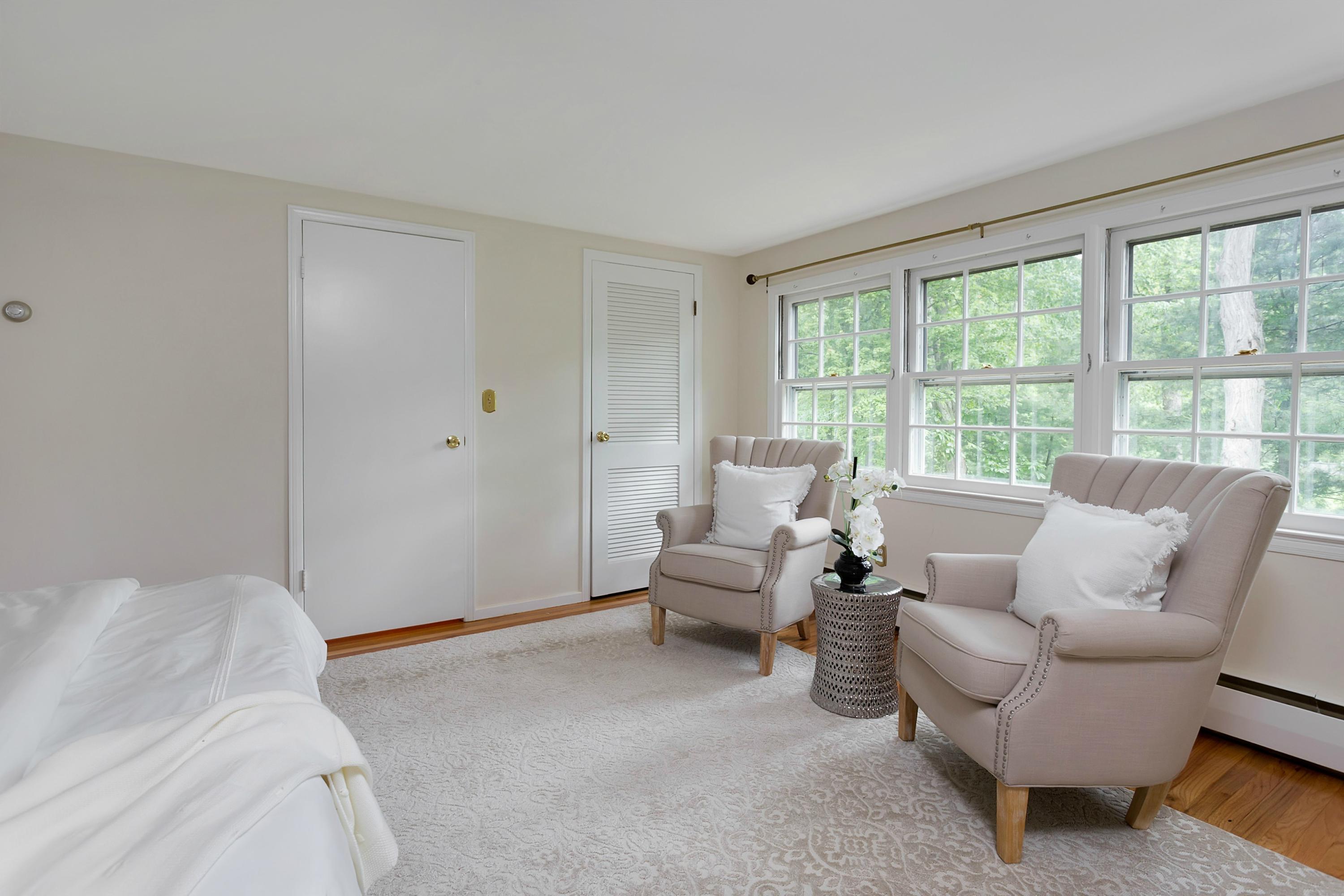 276 Smith Ridge Road New Canaan, CT 06840 - Photo 14 of 23 a living room with furniture and a large window