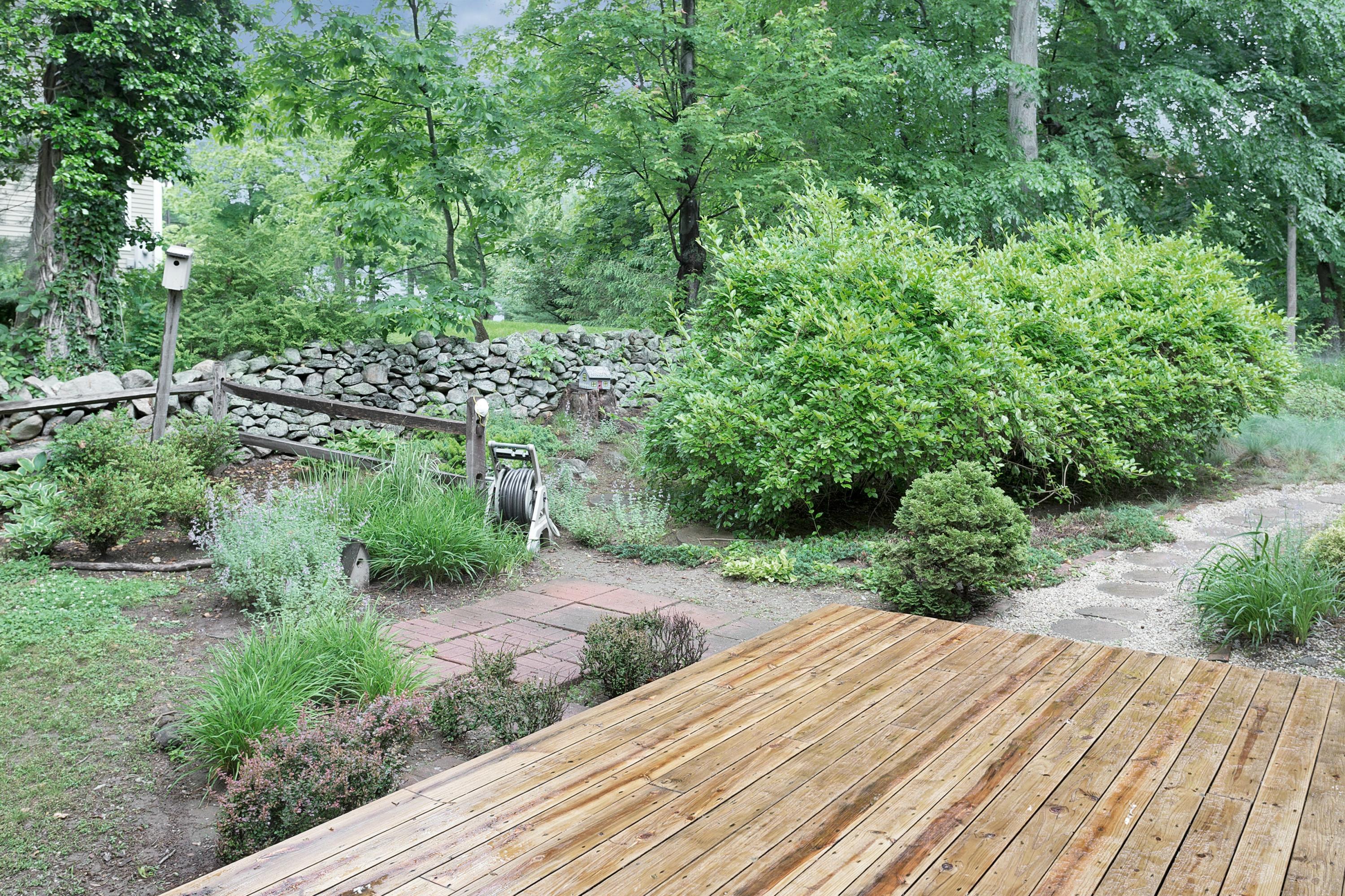 276 Smith Ridge Road New Canaan, CT 06840 - Photo 20 of 23 a view of a wooden space with a pathway
