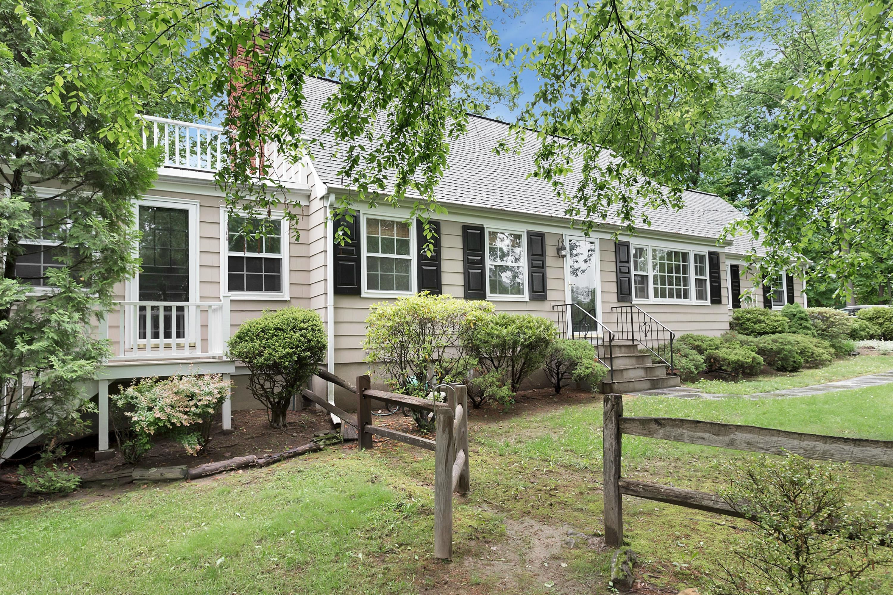 276 Smith Ridge Road New Canaan, CT 06840 - Photo 2 of 23 front view of a house with a yard