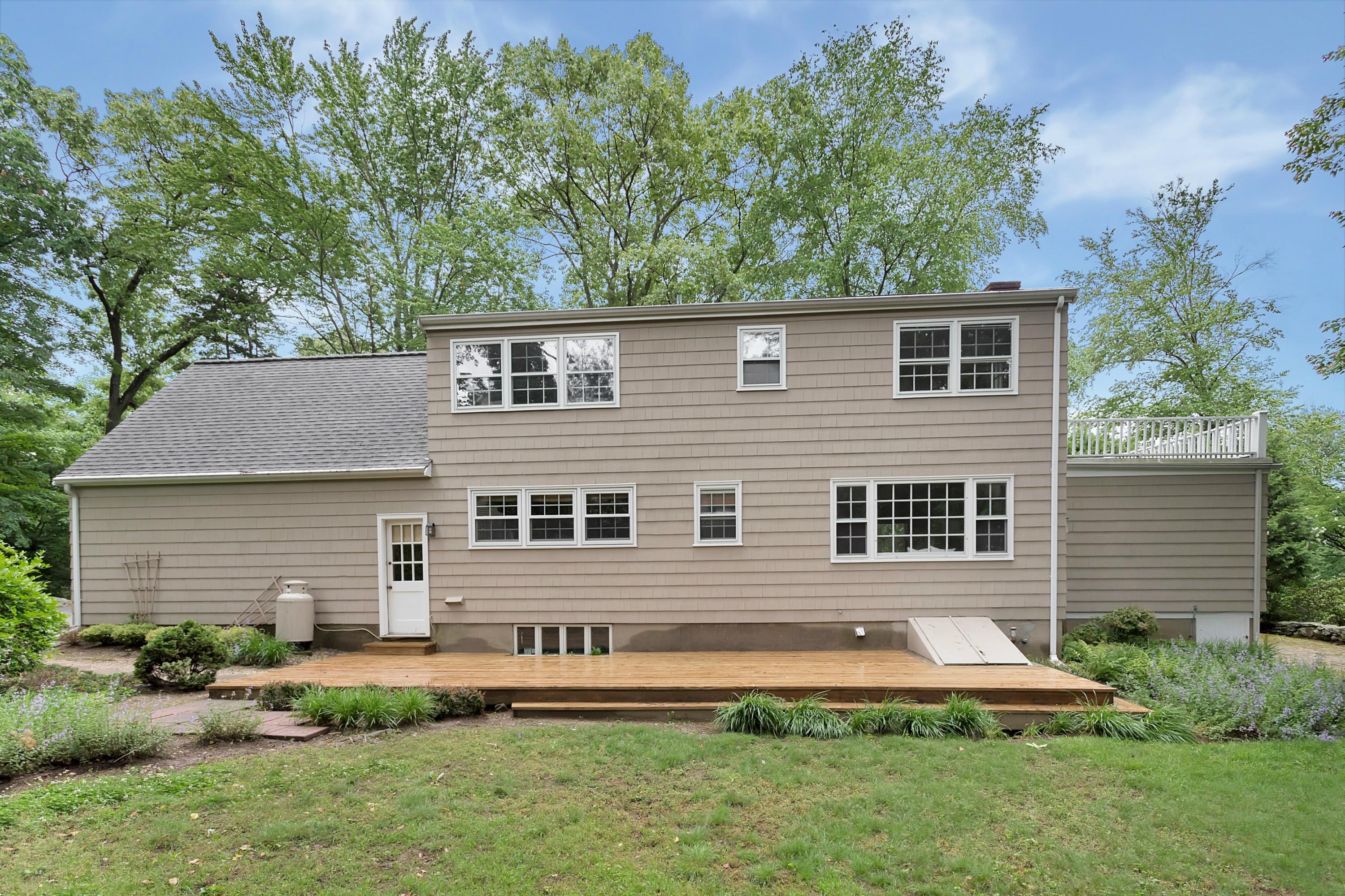 276 Smith Ridge Road New Canaan, CT 06840 - Photo 22 of 23 front view of a house with a yard