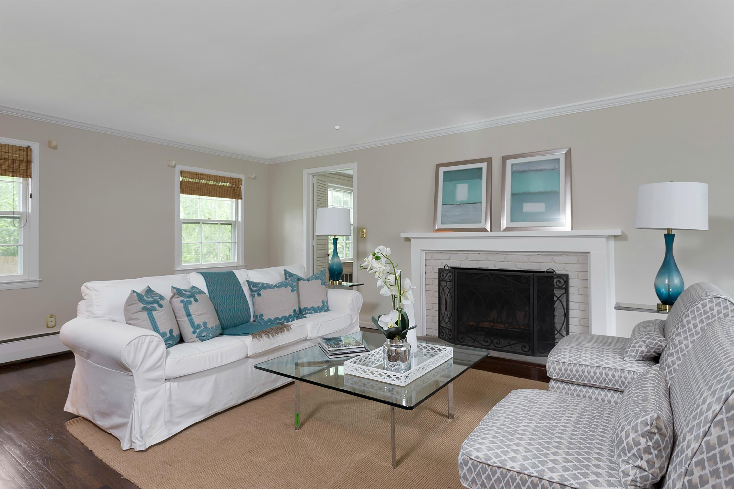 276 Smith Ridge Road New Canaan, CT 06840 - Photo 3 of 23 a living room with furniture a fireplace and a window